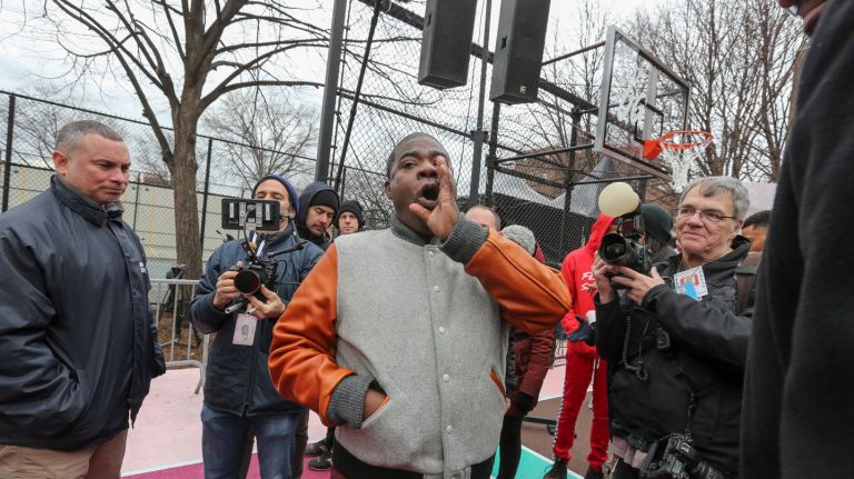 Tracy Morgan hangs out at the  refurbished basketball courts at the Marcy Playground on Tuesday.