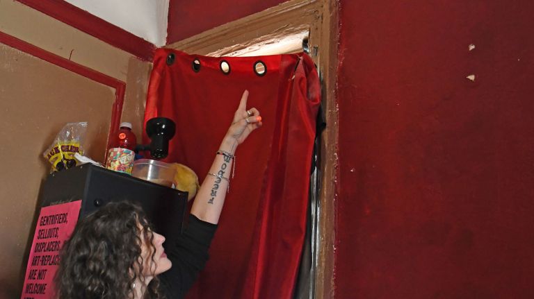 Bronx landlord accused of neglecting tenants: Photos 15 Lisa Ortega points to an area in the ceiling of her Bronx apartment where water damage has been a chronic problem for many years.