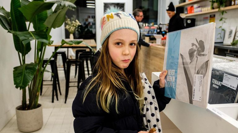 Zoe Ross Allen 8, of Bed Stuy, examines an album at The Mixtape Shop on Bedford Avenue, Wednesday, Jan. 10, 2018.