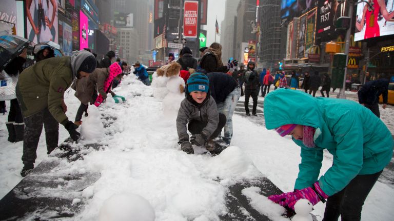 Snow in NYC: Photos from winter 2016-2017 36 Children make snowmen in Manhattan's Times Square on Tuesday, March 14, 2017.