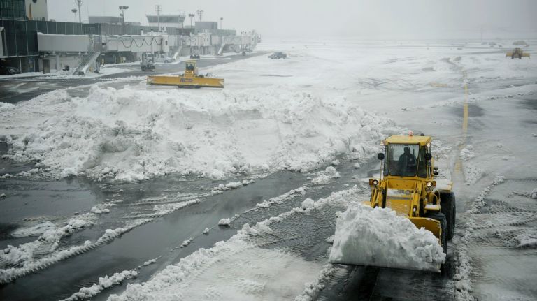 Snow in NYC: Photos from winter 2016-2017 40 Plows clear a tarmac at LaGuardia Airport in Queens during the snowstorm on Tuesday, March 14, 2017.
