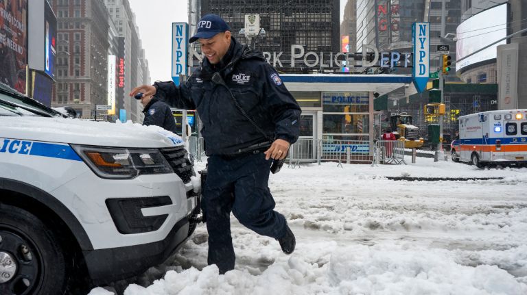 Snow in NYC: Photos from winter 2016-2017 42 An NYPD officer navigates the slushy snow in Times Square in Manhattan during the storm that blanketed the area with snow and sleet on Tuesday, March 14, 2017.