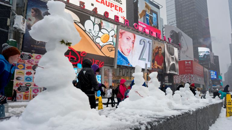 Snow in NYC: Photos from winter 2016-2017 43 Small snowmen appear in Times Square during the snowstorm on Tuesday, March 14, 2017.