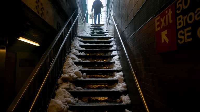 Snow in NYC: Photos from winter 2016-2017 48 A pedestrian cautiously walks down snowy stairs to the 1 train at 50th Street in Manhattan on Tuesday, March 14, 2017, during a snowstorm.