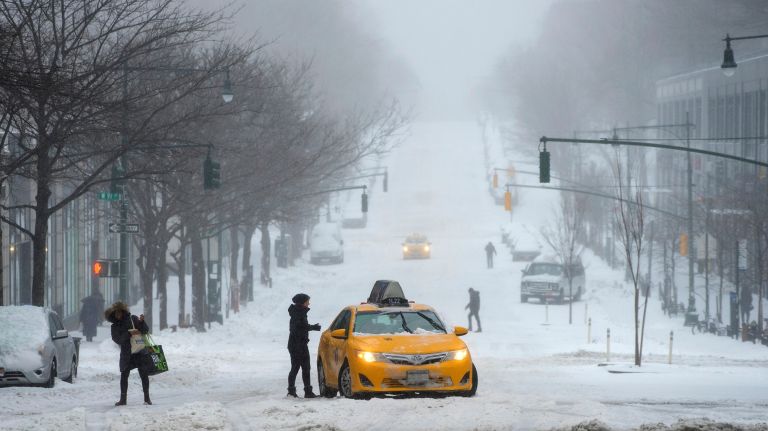 Snow in NYC: Photos from winter 2016-2017 50 A yellow cab gets stuck for a few minutes on an upgrade along Columbus Avenue during the snowstorm on the Upper West Side of Manhattan on Tuesday, March 14, 2017.