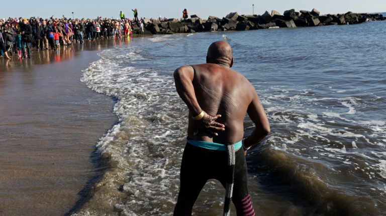 A man prepares to run into the ocean during the Coney Island Polar Bear Club's New Year's Day Swim on Jan. 1, 2017.