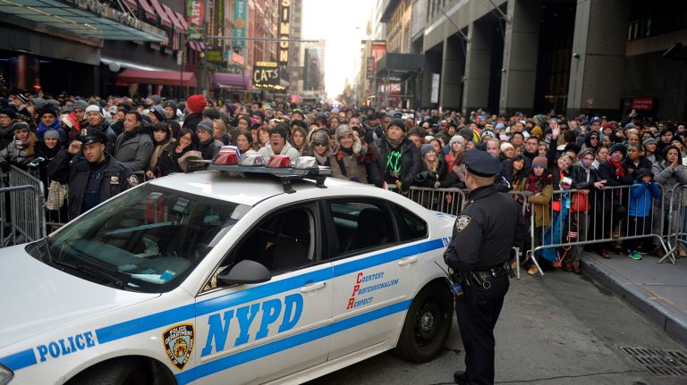 New Year's Eve Times Square ball drop: See photos 46 People line up behind police barriers on 52nd Street before being let in to Times Square for the 2017 New Year's Eve celebration.