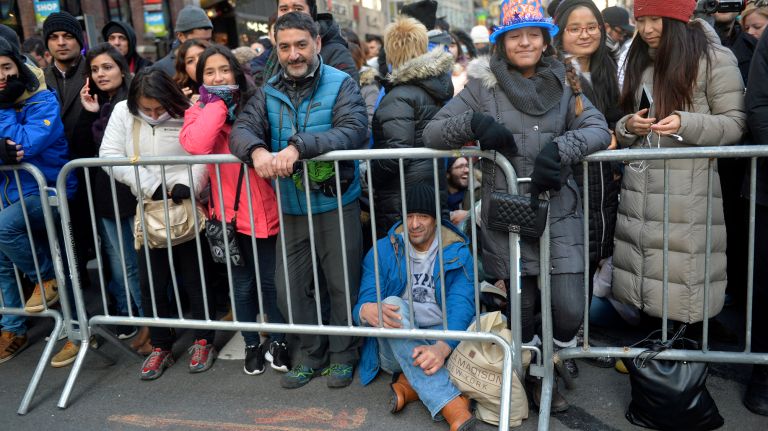New Year's Eve Times Square ball drop: See photos 48 People wait behind police barriers for the 2017 New Year's Eve celebration in Times Square on Saturday, Dec. 31, 2016.