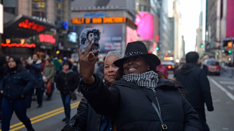 New Year's Eve Times Square ball drop: See photos 52 From left, Elicia Stanley, 44, and her friend Rondalyn Spurlock, 44, traveled from Los Angeles to be in Times Square for the 2017 New Year's Eve celebration on Saturday, Dec. 31, 2016.