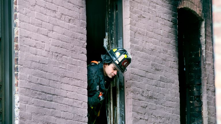 Fire in Belmont, Bronx: Photos from the scene 16 An FDNY firefighter looks out the window of a building Friday, Dec. 29, 2017, where a fatal fire in the Bronx killed 12 people Thursday evening.