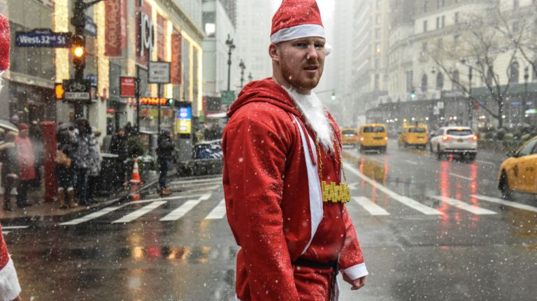 A Santa shows off his festive bling during SantaCon on Saturday, Dec. 9, 2017.