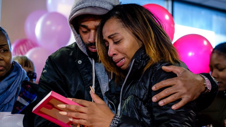 Shamika Gonzalez, Bella Edwards' mother, is comforted by her brother Roberto Gonzalez during a vigil on Wednesday, April 4.