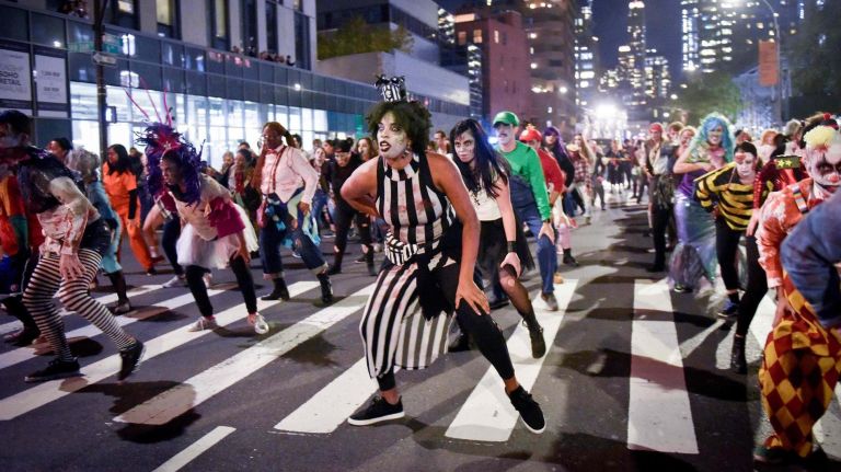 Thousands of costumed characters march up Sixth Ave in the Village Halloween Parade on Oct. 31, 2018.