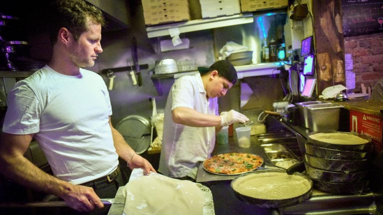 Emmett Burke brought Chicago deep dish pizza to MacDougal Street in the Village five years ago. Patrons eat their pizza with a knife and fork here.