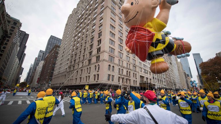 The Charlie Brown balloon rounds a corner at Sixth Avenue and 59th Street on Thursday, Nov. 24, 2016, during the 90th annual Macy's Thanksgiving Day Parade in Manhattan.