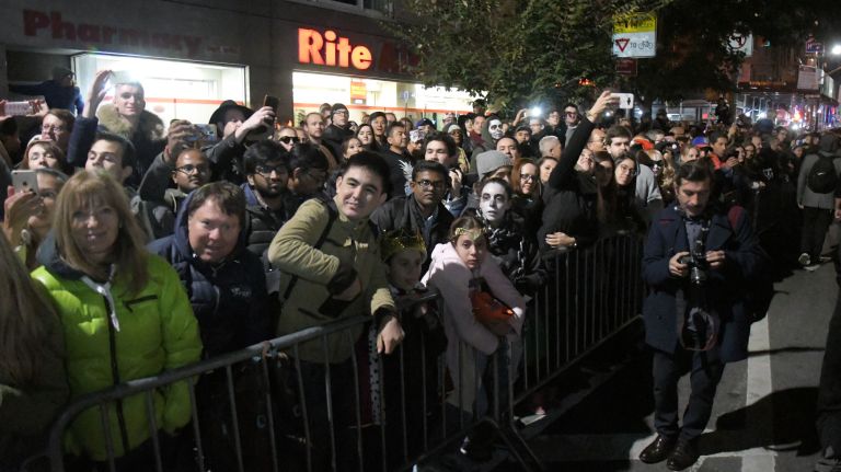 Village Halloween Parade photos highlight city's spookier side 42 A large crowd gathers along the route as the parade marchers travel up Sixth Avenue for the 44th annual Village Halloween Parade in Manhattan, Tuesday, Oct. 31, 2017.