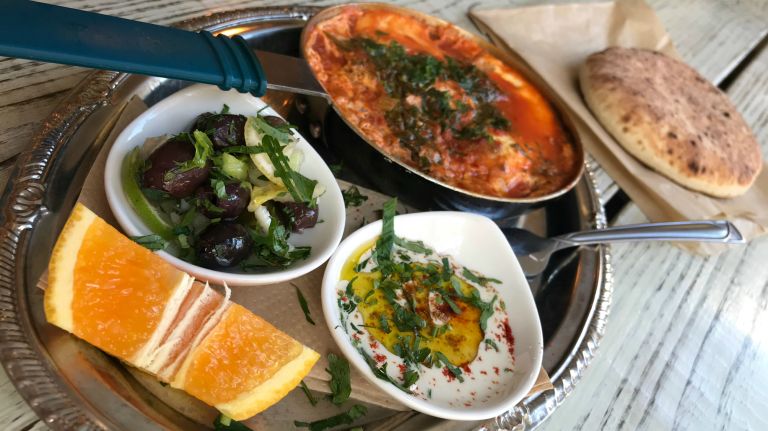 Check out Yorkville's Mellow Yellow cafe on 90th Street and First Avenue. The eatery, which reflects the immigrant residents from Czechoslovakia, Poland, Hungary, Lebanon and Ireland who moved there in the last century, offers muffins and coffee but also has a menu featuring flavors form the East. One of those dishes is Shakshuka: an Israeli brunch dish with poached eggs, olives and Moroccan tomato sauce served in a skillet.