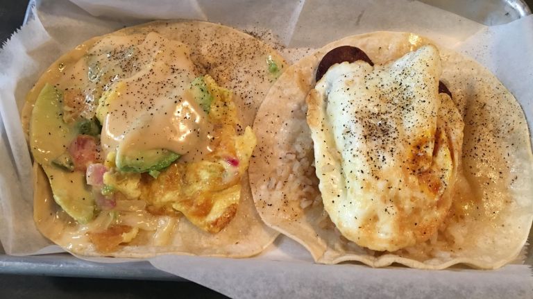 Swell Dive  is opening a take-away window so you can easily grab its  breakfast tacos, which include Tex-Mex options like the  a-migas, left, and Filipino tacos like the longsilog, right.