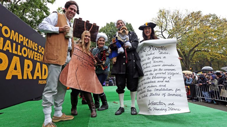 Patriotic pooches are part of the annual Halloween Dog Parade at Tompkins Square Park, Manhattan, October 22, 2016.