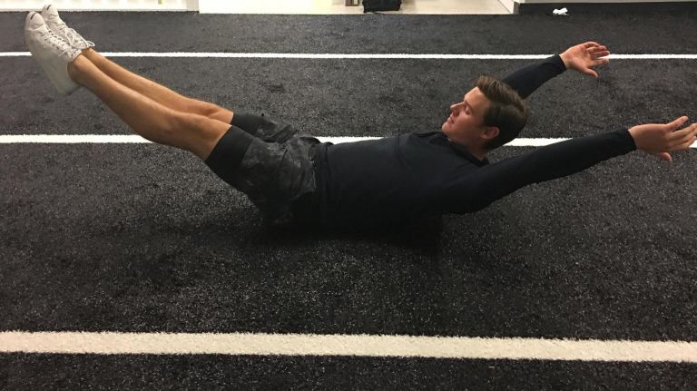 Alex Dropo demonstrates the hollow body. for article on Neil Patrick Harris' trainer. Photo by amNewYork staffer Meredith Deliso