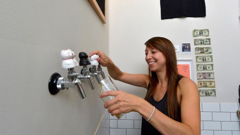 New fall beers: Brews from KCBC, Five Boroughs, Grimm and Interboro 5 Owner Cat DiPaci (26) at Beer Fridge, her new beer shop located at 41 Essex St., Manhattan. From Saturday, Oct. 7, 2017.