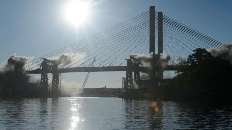 Old Kosciuszko Bridge finally comes down: See photos 10 Smoke rises as sections of the old Kosciuszko Bridge are demolished using a process called energetic felling on both the Queens and Brooklyn sides of the Newtown Creek, Sunday,Oct. 1, 2017. The energetic felling required the placement of little charges at key joints on the bridge so that when the charges went off, the bridge broke apart and fell directly down.