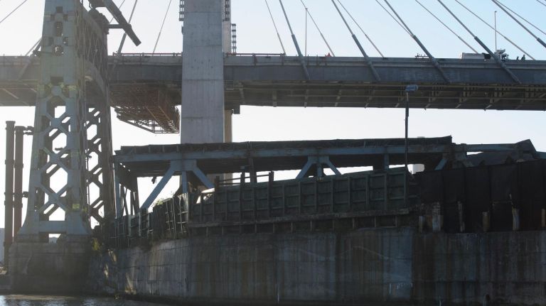 Old Kosciuszko Bridge finally comes down: See photos 17 Remnants of sections of the old Kosciuszko Bridge that were demolished using a process called energetic felling on both the Queens and Brooklyn sides of the Newtown Creek, Sunday,Oct. 1, 2017. The energetic felling required the placement of little charges at key joints on the bridge so that when the charges went off, the bridge broke apart and fell directly down.