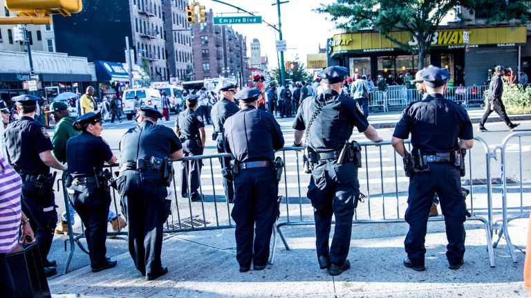 J'Ouvert festival: Photos of the early morning Caribbean celebration 27 NYPD officers stand behind barrier fences along the J'Ouvert parade route on Nostrand Avenue and Empire Boulevard in Brooklyn on Monday, Sept. 4, 2017.