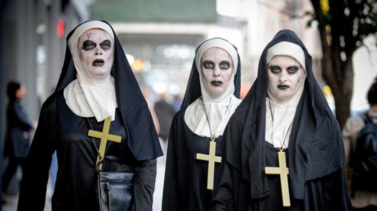 Undead nuns march down a Village street.