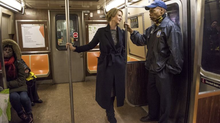 Cynthia Nixon, who seeks the Democratic nomination for governor, and Brooklyn borough President Eric Adams ride the C train Wednesday and talk about transit funding sources.