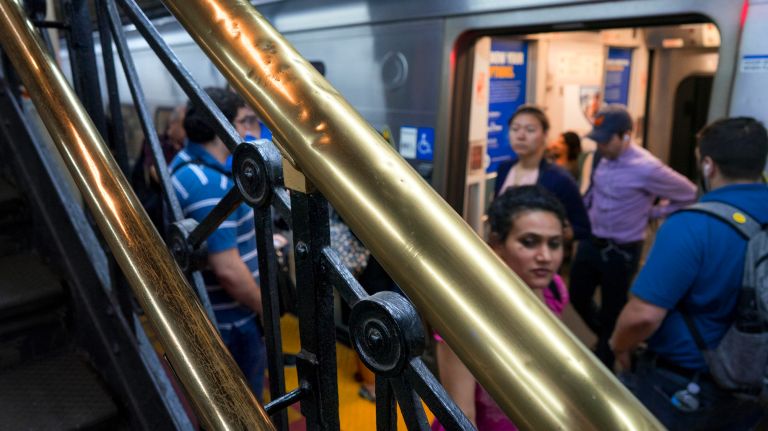 Penn Station's history is hidden in plain sight 13 Passengers disembark from an LIRR train as an original brass railing still graces the platform at Penn Station in Manhattan, Thursday, July 27, 2017. Perhaps some passengers may not realize it, but many of the banisters and brass handrails leading to LIRR platforms were part of the original Penn Station that opened more than 100 years ago.
