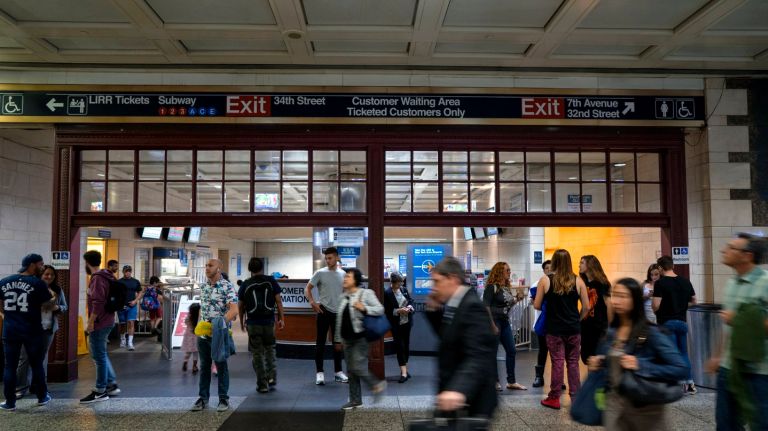 Penn Station's history is hidden in plain sight 14 Commuters at the main LIRR station area of Penn Station in Manhattan walk past the passenger seating room on Thursday, July 27, 2017. What many may not realize is this waiting room is framed by a large piece of the original Penn Station's history: within steps every day for those coming and going stands a 30-foot-wide, Tuscan red, cast-iron partition with beveled-glass windows that was incorporated into later renovations.