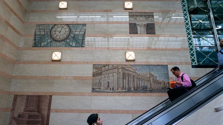 Penn Station's history is hidden in plain sight 16 Passengers ride escalators into the recently renovated New Jersey Transit entrance at Penn Station in Manhattan, Thursday, July 27, 2017. As renovations were made, the old Penn Station continued to inspire, with images of the train station clearly integrated into this modern design.