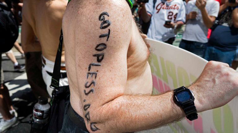 People march in the GoTopless Pride Parade on Sunday, Aug. 28, 2016, in Manhattan.