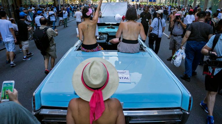 People march at the front of the GoTopless Pride Parade on Sunday, Aug. 28, 2016, in Manhattan.