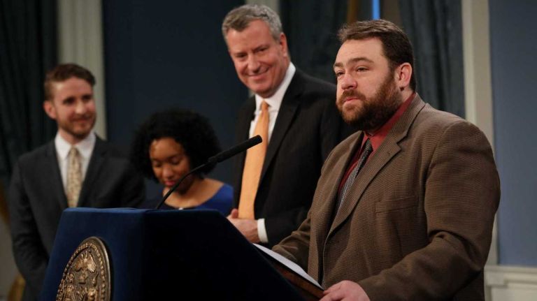 Phillip Walzak was named deputy commissioner for public information for the NYPD in March 2018. Above, he's introduced as Mayor Bill de Blasio's press secretary in 2014.
