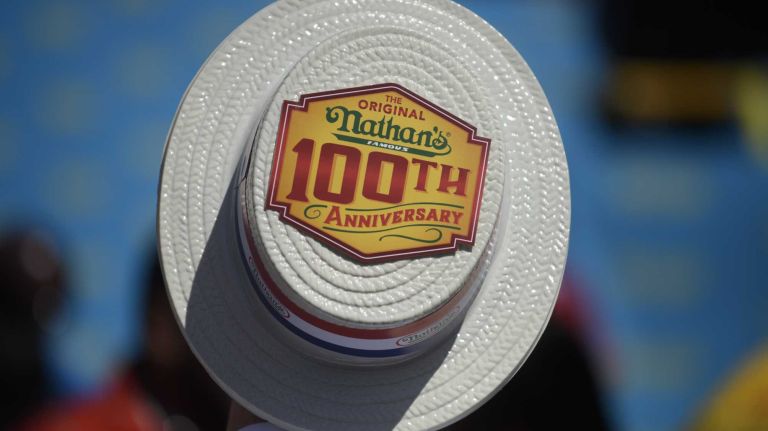 Fans enjoy Nathan's Famous Fourth of July International Hot Dog Eating Contest in Coney Island, Brooklyn, on Monday, July 4, 2016. This year marks the 100th anniversary of the annual Fourth of July hot dog eating contest.