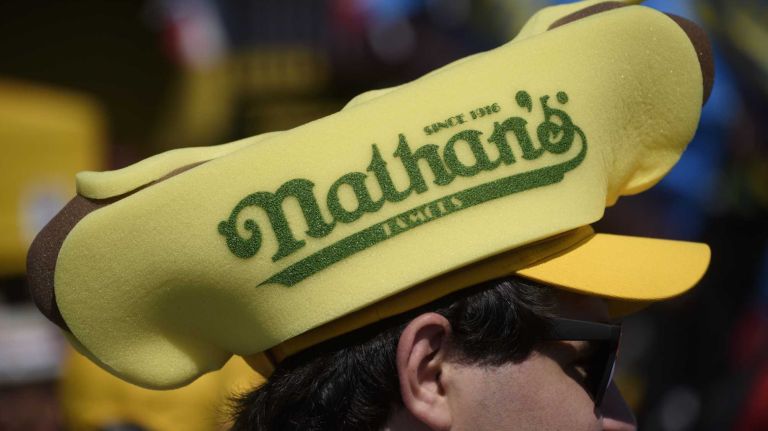 Fans enjoy Nathan's Famous Fourth of July International Hot Dog Eating Contest in Coney Island, Brooklyn, on Monday, July 4, 2016. This year marks the 100th anniversary of the annual Fourth of July hot dog eating contest.
