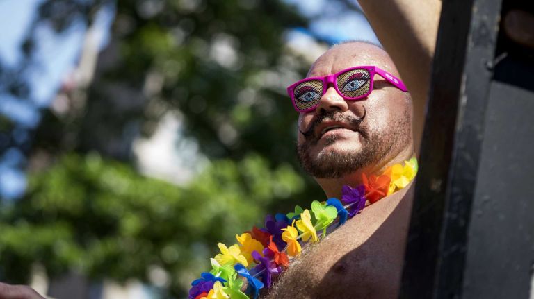 NYC Pride March 2016: See photos of the annual march to commemorate the Stonewall riots 81 A person on a float waves to spectators as paradegoers march in the 46th annual New York City Pride March on Fifth Avenue in Manhattan on Sunday, June 26, 2016. This year's Pride parade pays tribute to the 49 killed in the shooting at a gay nightclub in Orlando, Florida, two weeks ago on June 12.