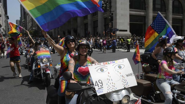 NYC Pride March 2016: See photos of the annual march to commemorate the Stonewall riots 106 Participants with posters and photographs of Orlando shooting victims ride in the 46th annual New York City Pride March on Fifth Avenue in Manhattan on Sunday, June 26, 2016. This year's Pride parade pays tribute to the 49 killed in the shooting at a gay nightclub in Orlando, Florida, two weeks ago on June 12.