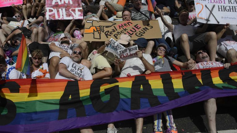 NYC Pride March 2016: See photos of the annual march to commemorate the Stonewall riots 109 Participants marching signs saying