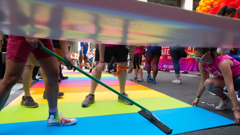 NYC Pride March 2016: See photos of the annual march to commemorate the Stonewall riots 118 Volunteers lay down a rainbow walkway as paradegoers march in the 46th annual New York City Pride March on Fifth Avenue in Manhattan on Sunday, June 26, 2016. This year's Pride parade pays tribute to the 49 killed in the shooting at a gay nightclub in Orlando, Florida, two weeks ago on June 12.