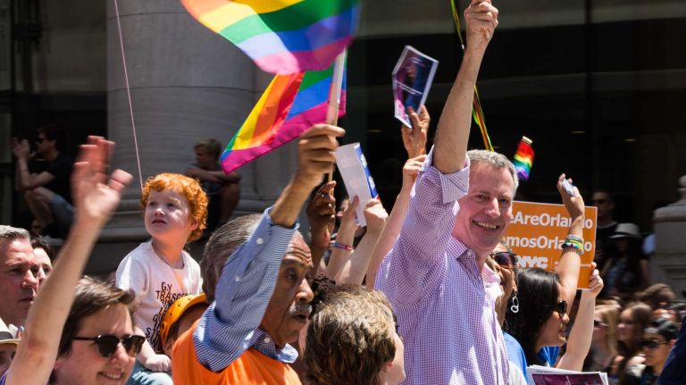 NYC Pride March 2016: See photos of the annual march to commemorate the Stonewall riots 121 Mayor Bill de Blasio and the Rev. Al Sharpton, left, march in the 46th annual New York City Pride March on Fifth Avenue in Manhattan on Sunday, June 26, 2016. This year's Pride parade pays tribute to the 49 killed in the shooting at a gay nightclub in Orlando, Florida, two weeks ago on June 12.