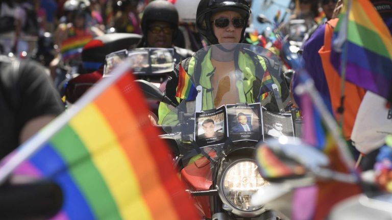NYC Pride March 2016: See photos of the annual march to commemorate the Stonewall riots 122 Photos of Orlando shooting victims are seen on motorcycles at the 46th annual New York City Pride March on Fifth Avenue in Manhattan on Sunday, June 26, 2016. This year's Pride parade pays tribute to the 49 killed in the massacre at a gay nightclub in Orlando, Florida, two weeks ago on June 12.