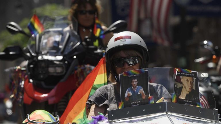 NYC Pride March 2016: See photos of the annual march to commemorate the Stonewall riots 124 Photos of Orlando shooting victims are seen on motorcycles at the 46th annual New York City Pride March on Fifth Avenue in Manhattan on Sunday, June 26, 2016. This year's Pride parade pays tribute to the 49 killed in the massacre at a gay nightclub in Orlando, Florida, two weeks ago on June 12.