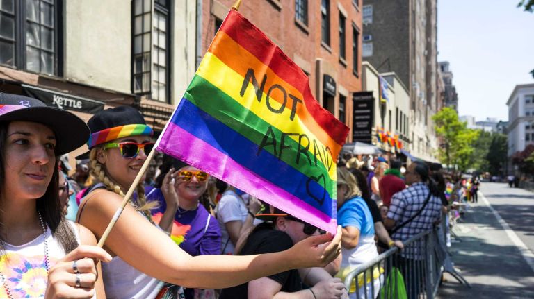 NYC Pride March 2016: See photos of the annual march to commemorate the Stonewall riots 141 People wave flags as participants walk by in the New York City Pride March near The Stonewall Inn in West Village on Sunday, June 26, 2016.