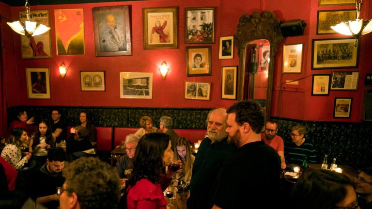 Artwork and photographs of the Cold War era highlight the walls of the KGB Bar.
