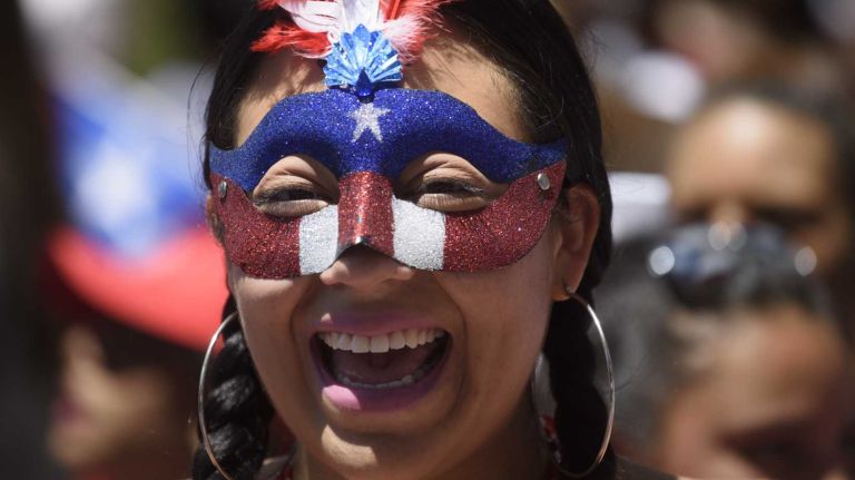 Puerto Rican Day Parade 2016 held in NYC: See photos from the Fifth Avenue festivities 41 Staten Island resident Iris Rosa celebrates during the Puerto Rican Day Parade in Manhattan on Sunday, June 12, 2016.