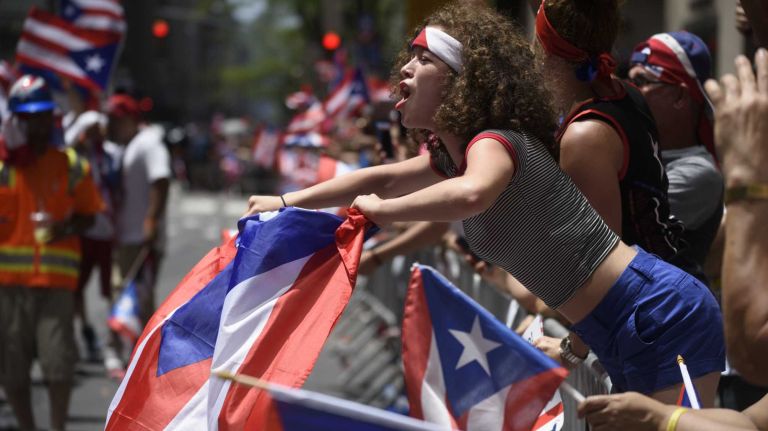 Puerto Rican Day Parade 2016 held in NYC: See photos from the Fifth Avenue festivities 42 Spectators lining Fifth Avenue celebrate during the Puerto Rican Day Parade in Manhattan on Sunday, June 12, 2016.