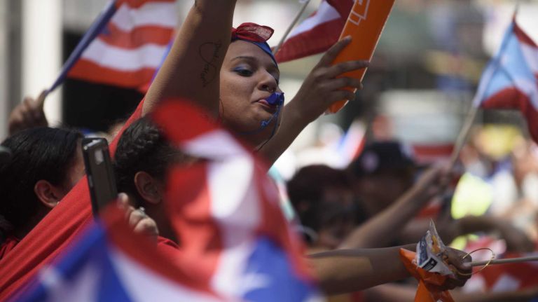 Puerto Rican Day Parade 2016 held in NYC: See photos from the Fifth Avenue festivities 51 Spectators enjoy the festive atmosphere on Fifth Avenue during the 59th annual Puerto Rican Day Parade in Manhattan on Sunday, June 12, 2016.
